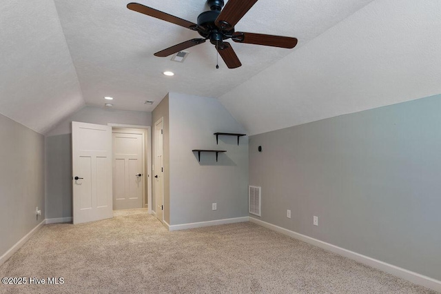 bonus room featuring visible vents, a ceiling fan, baseboards, and lofted ceiling