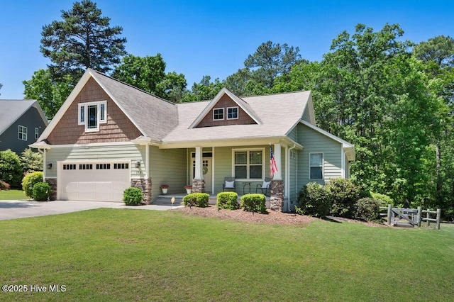 craftsman-style home featuring fence, covered porch, a front lawn, and stone siding