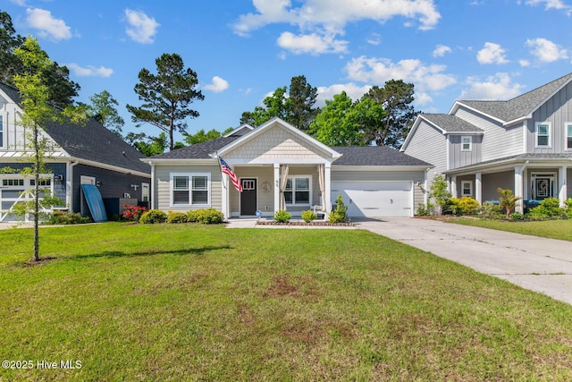view of front facade with a porch, a front lawn, an attached garage, and concrete driveway