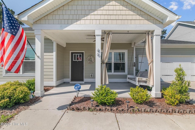 property entrance with an attached garage and covered porch