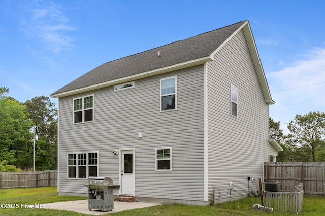 rear view of property featuring fence and cooling unit