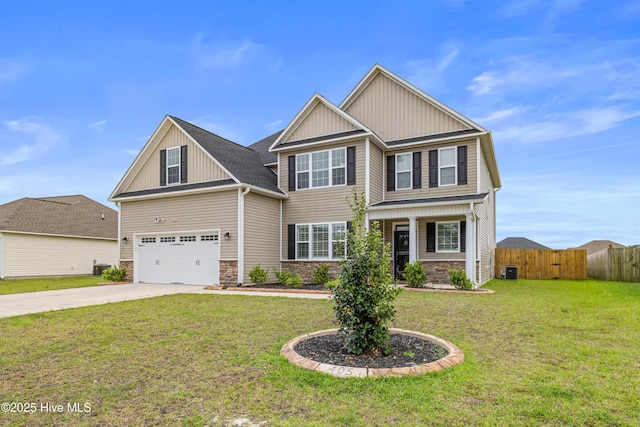 craftsman house with fence, an attached garage, a front lawn, board and batten siding, and driveway