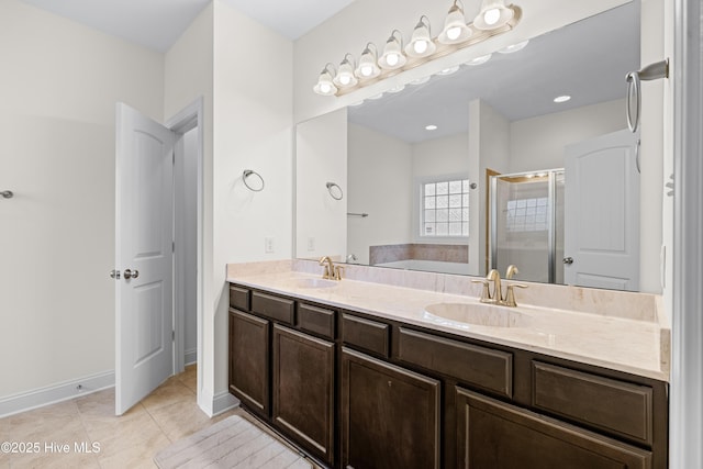 full bathroom featuring tile patterned flooring, double vanity, a bath, a shower stall, and a sink