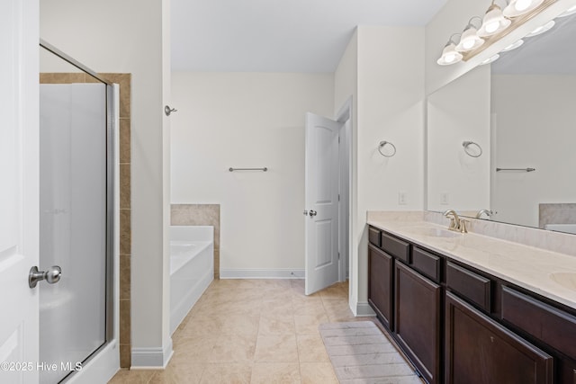 full bath featuring double vanity, a sink, a garden tub, and a stall shower