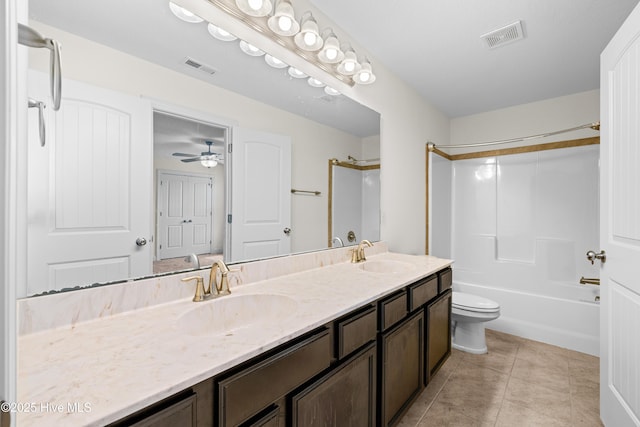 full bathroom with visible vents, a sink, double vanity, and toilet