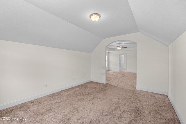 bonus room featuring baseboards, carpet flooring, and lofted ceiling