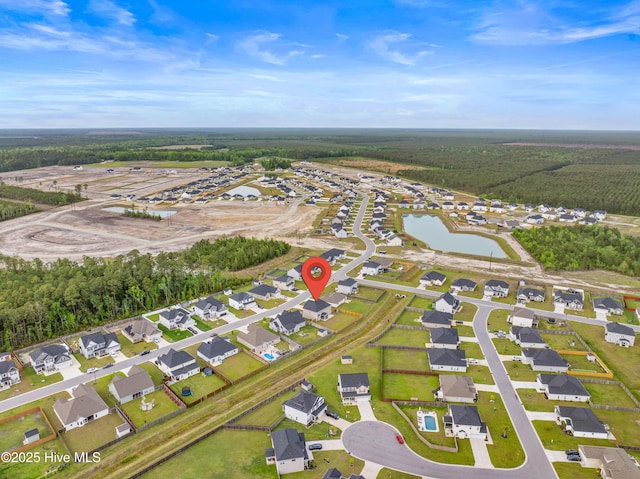 bird's eye view featuring a residential view and a water view