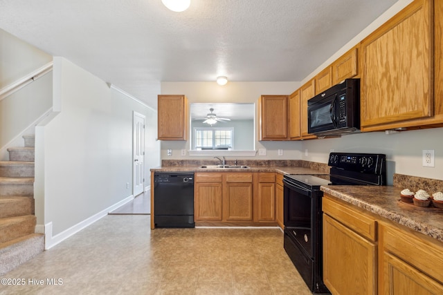 kitchen with a sink, ceiling fan, brown cabinetry, and black appliances