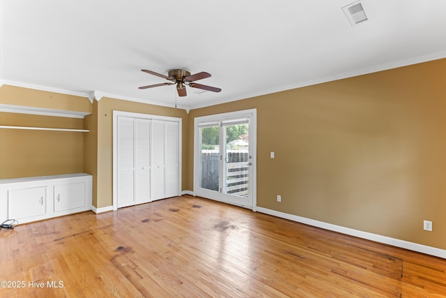 814 Latimer Dr, Wilmington, NC 28403 - unfurnished bedroom with access to exterior, crown molding, light wood finished floors, baseboards, and ceiling fan