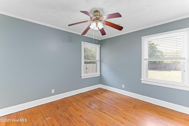 814 Latimer Dr, Wilmington, NC 28403 - empty room with baseboards, hardwood / wood-style floors, ceiling fan, and ornamental molding