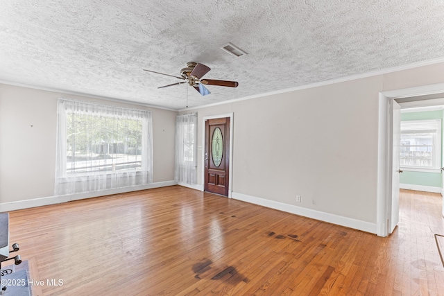 814 Latimer Dr, Wilmington, NC 28403 - entrance foyer with hardwood / wood-style floors, baseboards, a ceiling fan, a textured ceiling, and ornamental molding