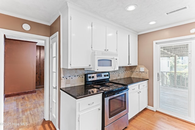 814 Latimer Dr, Wilmington, NC 28403 - kitchen with stainless steel electric range, white microwave, crown molding, light wood-style floors, and white cabinets