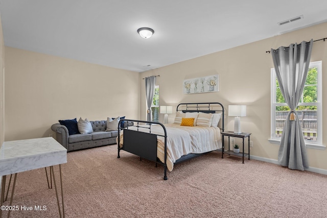 bedroom featuring visible vents, baseboards, and carpet floors