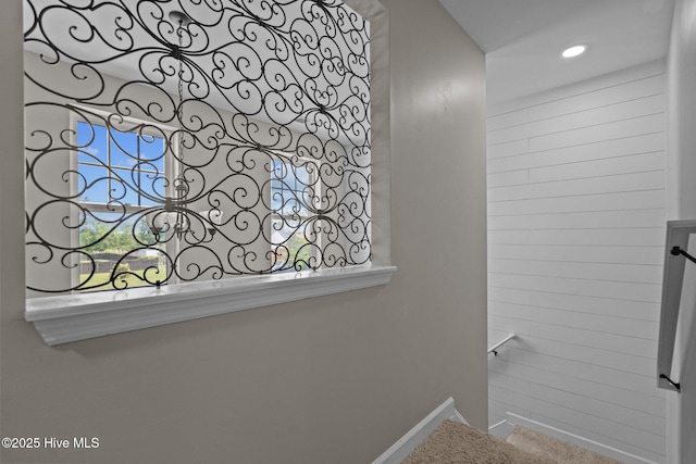 stairway featuring baseboards and recessed lighting