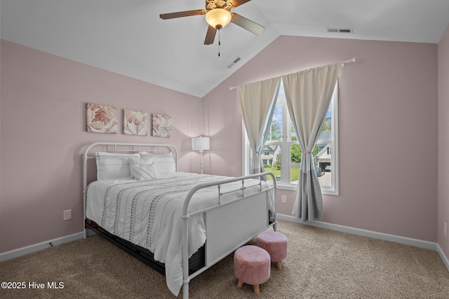 carpeted bedroom featuring a ceiling fan, baseboards, visible vents, and lofted ceiling