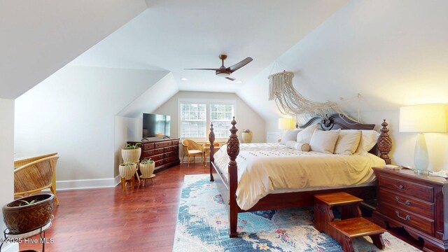 bedroom with baseboards, a ceiling fan, vaulted ceiling, and wood finished floors