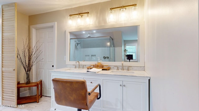 full bathroom featuring a sink, a stall shower, double vanity, and marble finish floor