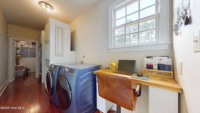 washroom featuring washer and dryer, baseboards, dark wood-style floors, and cabinet space