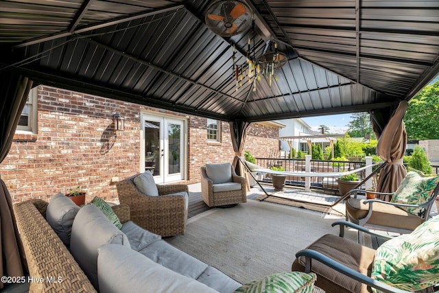 view of patio / terrace featuring french doors, a gazebo, and an outdoor hangout area