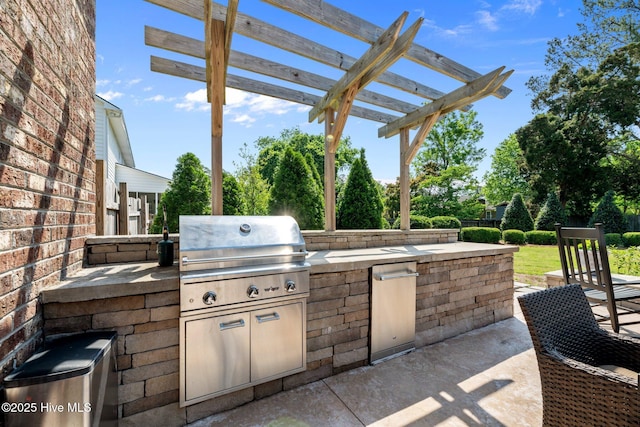 view of patio with a pergola and area for grilling