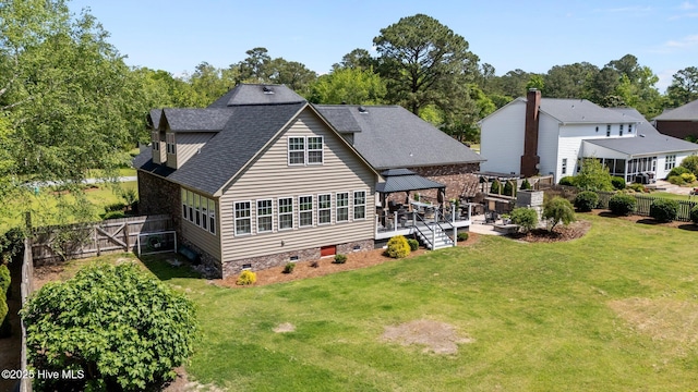 back of house with a gazebo, a fenced backyard, a yard, and crawl space