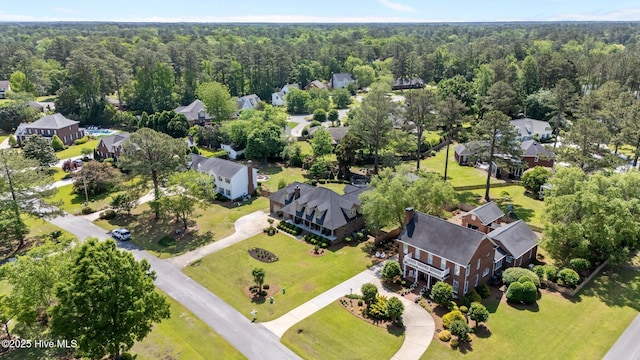 aerial view with a residential view and a wooded view