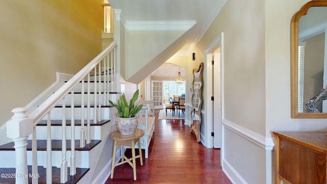 corridor featuring stairway, baseboards, crown molding, and dark wood-style floors