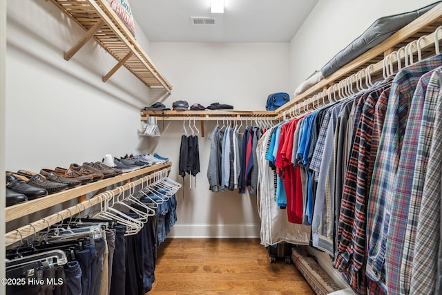 spacious closet with visible vents and wood finished floors