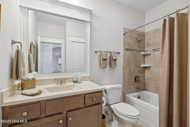 full bath featuring toilet, vanity, and shower / bath combination with curtain