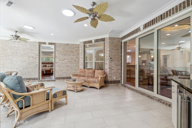 view of patio / terrace featuring a ceiling fan, visible vents, and outdoor lounge area