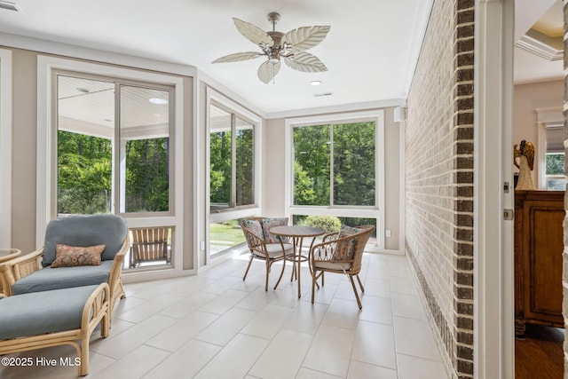sunroom with tile patterned flooring and visible vents