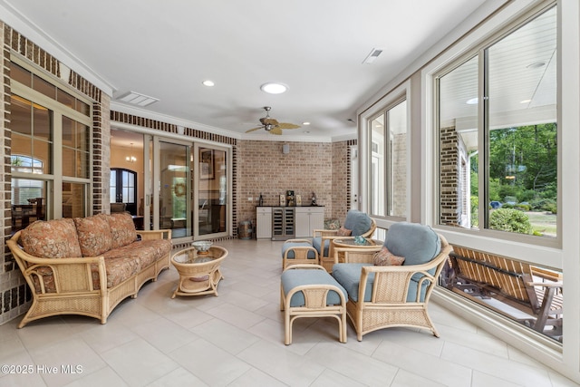 sunroom with recessed lighting, beverage cooler, ornamental molding, visible vents, and tile patterned flooring