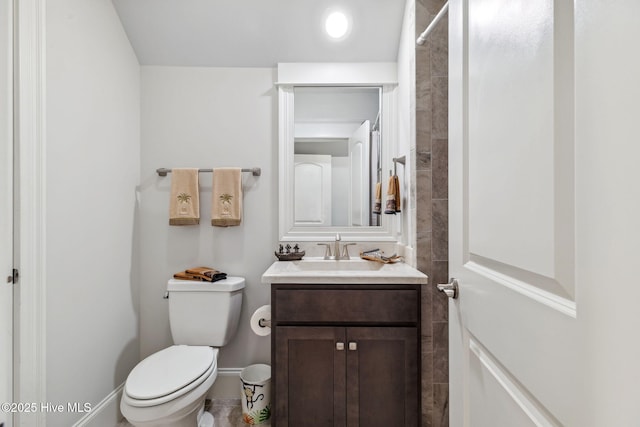 full bath with curtained shower, vanity, and toilet