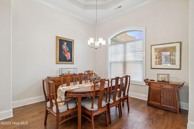 dining area with a chandelier, baseboards, visible vents, and dark wood finished floors