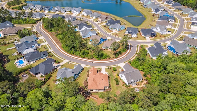 birds eye view of property featuring a water view and a residential view