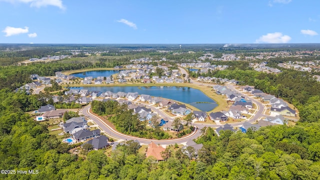 drone / aerial view with a water view and a residential view