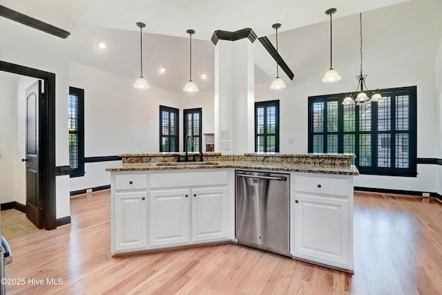 kitchen featuring stainless steel dishwasher, a sink, an inviting chandelier, and light wood-type flooring