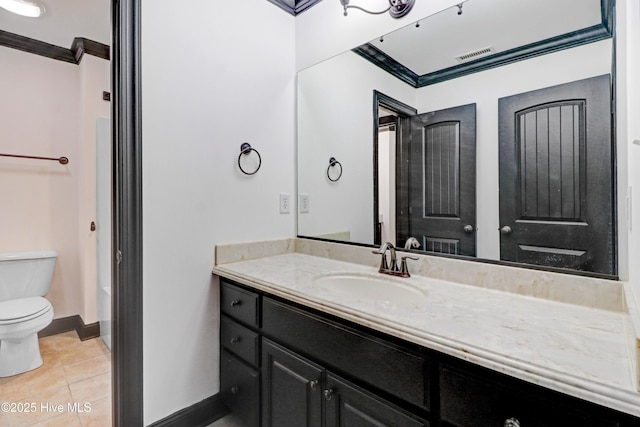 bathroom with vanity, toilet, tile patterned floors, baseboards, and visible vents