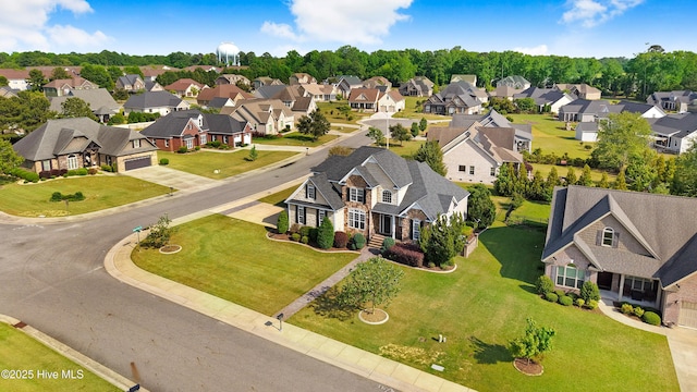 birds eye view of property with a residential view
