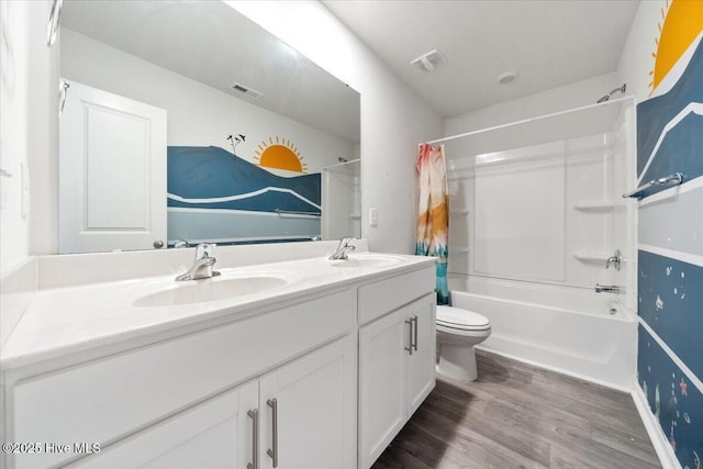bathroom featuring a sink, shower / bathtub combination with curtain, wood finished floors, and visible vents