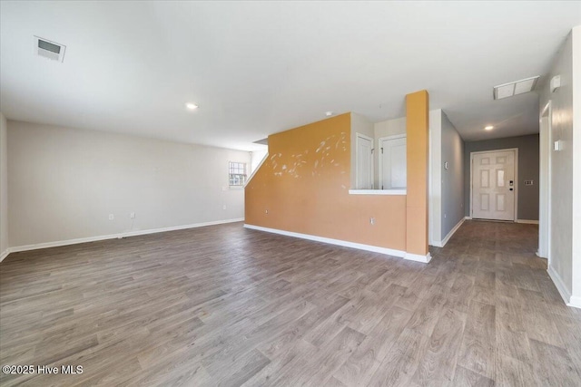 interior space with visible vents, recessed lighting, baseboards, and wood finished floors