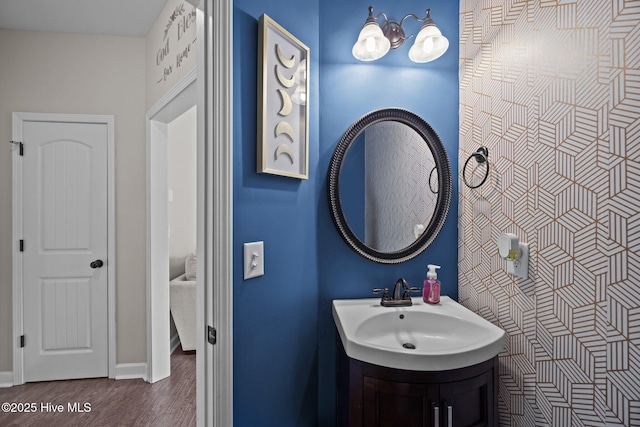 220 Rustic Field Dr, Goldsboro, NC 27530 - bathroom with wood finished floors, vanity, and baseboards