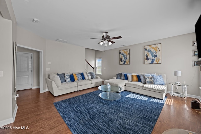 220 Rustic Field Dr, Goldsboro, NC 27530 - living room featuring wood finished floors, stairs, a ceiling fan, and baseboards