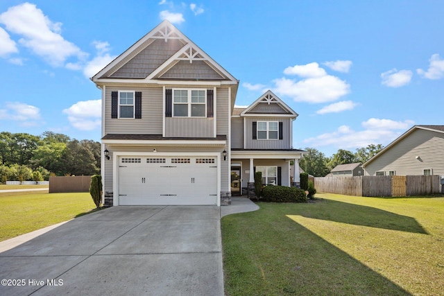 craftsman inspired home with a garage, fence, a front lawn, concrete driveway, and stone siding