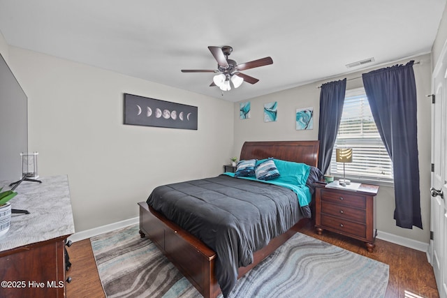 220 Rustic Field Dr, Goldsboro, NC 27530 - bedroom with baseboards, dark wood-style floors, and ceiling fan