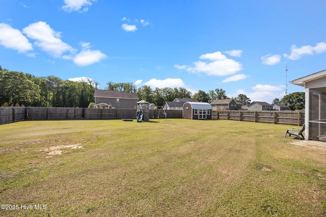 220 Rustic Field Dr, Goldsboro, NC 27530 - view of yard featuring a sunroom and a playground