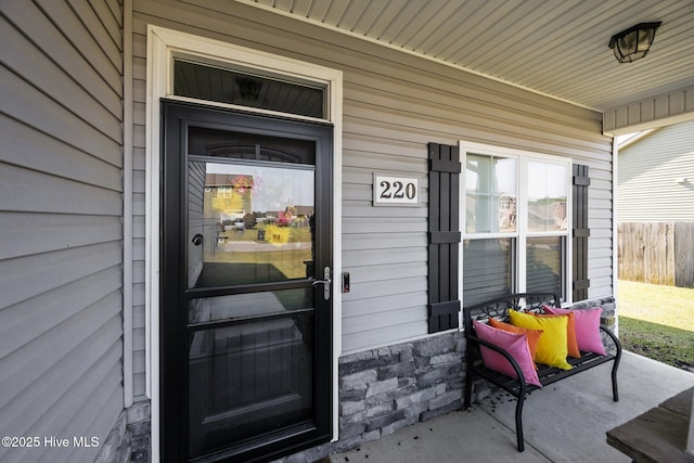220 Rustic Field Dr, Goldsboro, NC 27530 - property entrance with stone siding and a porch