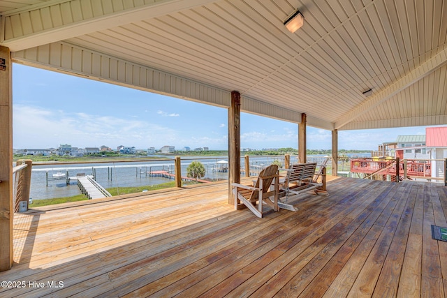 deck with a water view and a dock