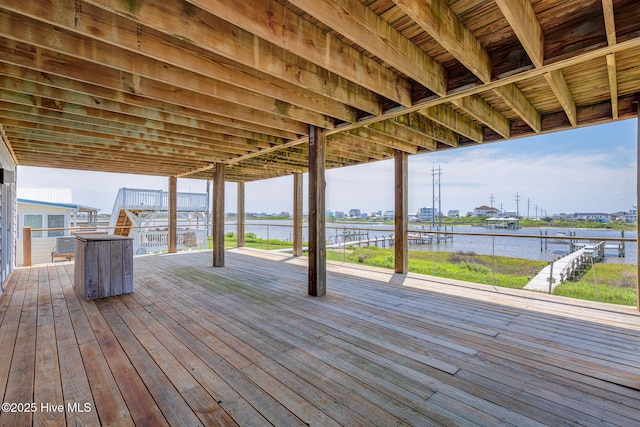 wooden deck featuring a water view