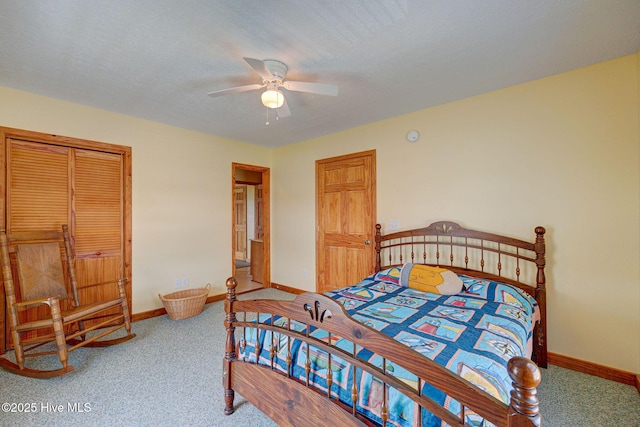 carpeted bedroom featuring baseboards and a ceiling fan